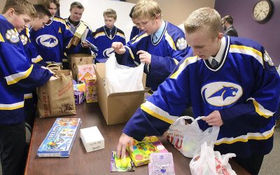 Sky View hockey team collects donations for Child & Family Support Center